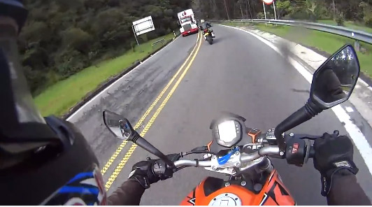 Video of two motorcycles getting owned by cyclist