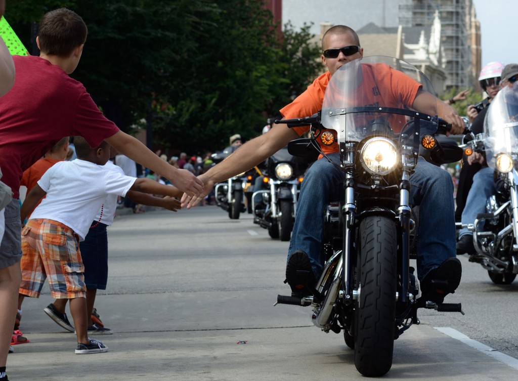 High Fives at the 110th Harley-Davidson parade on Wisconsin Road.